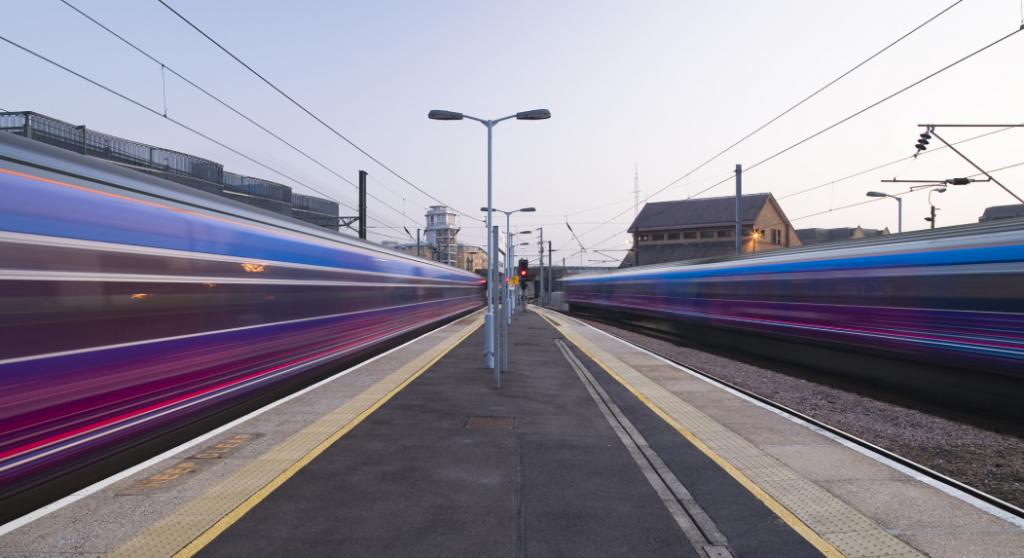 Two trains speeding by on track