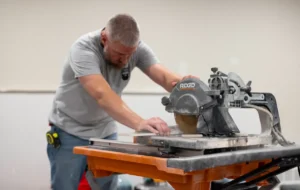 A man using a table saw