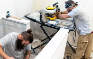 Two men working on cutting boards