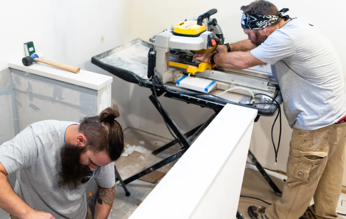 Two men working on cutting boards